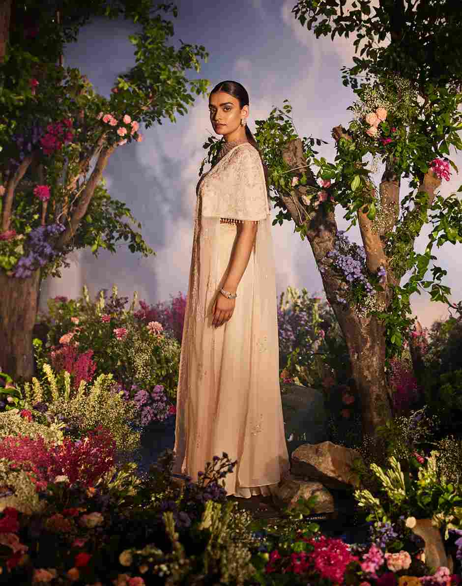 A model showcasing Suhana Cape Set by Miku Kumar from Miku Kumar's collection