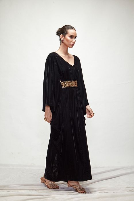 A model showcasing Black Velvet Kaftaan by Ranian from Ranian's collection A model showcasing Black Velvet Kaftaan by Ranian from Ranian's collection