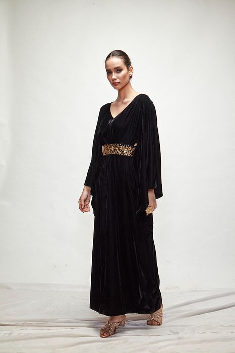 A model showcasing Black Velvet Kaftaan by Ranian from Ranian's collection A model showcasing Black Velvet Kaftaan by Ranian from Ranian's collection