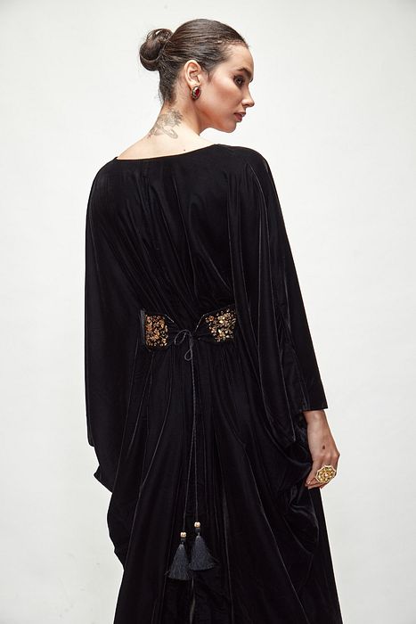 A model showcasing Black Velvet Kaftaan by Ranian from Ranian's collection A model showcasing Black Velvet Kaftaan by Ranian from Ranian's collection