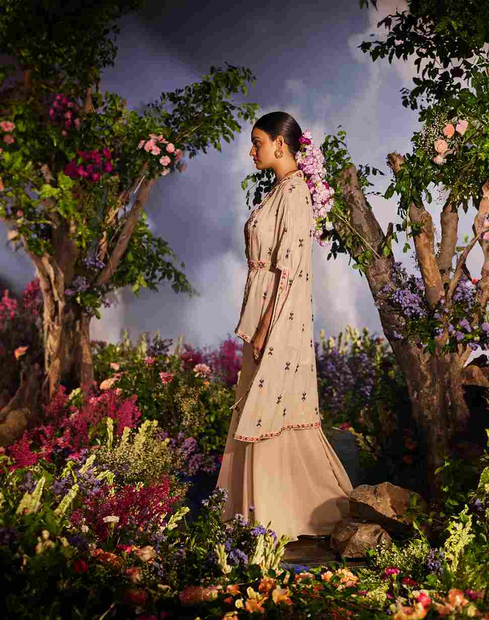A model showcasing Mayuri Cape Set by Miku Kumar from Miku Kumar's collection