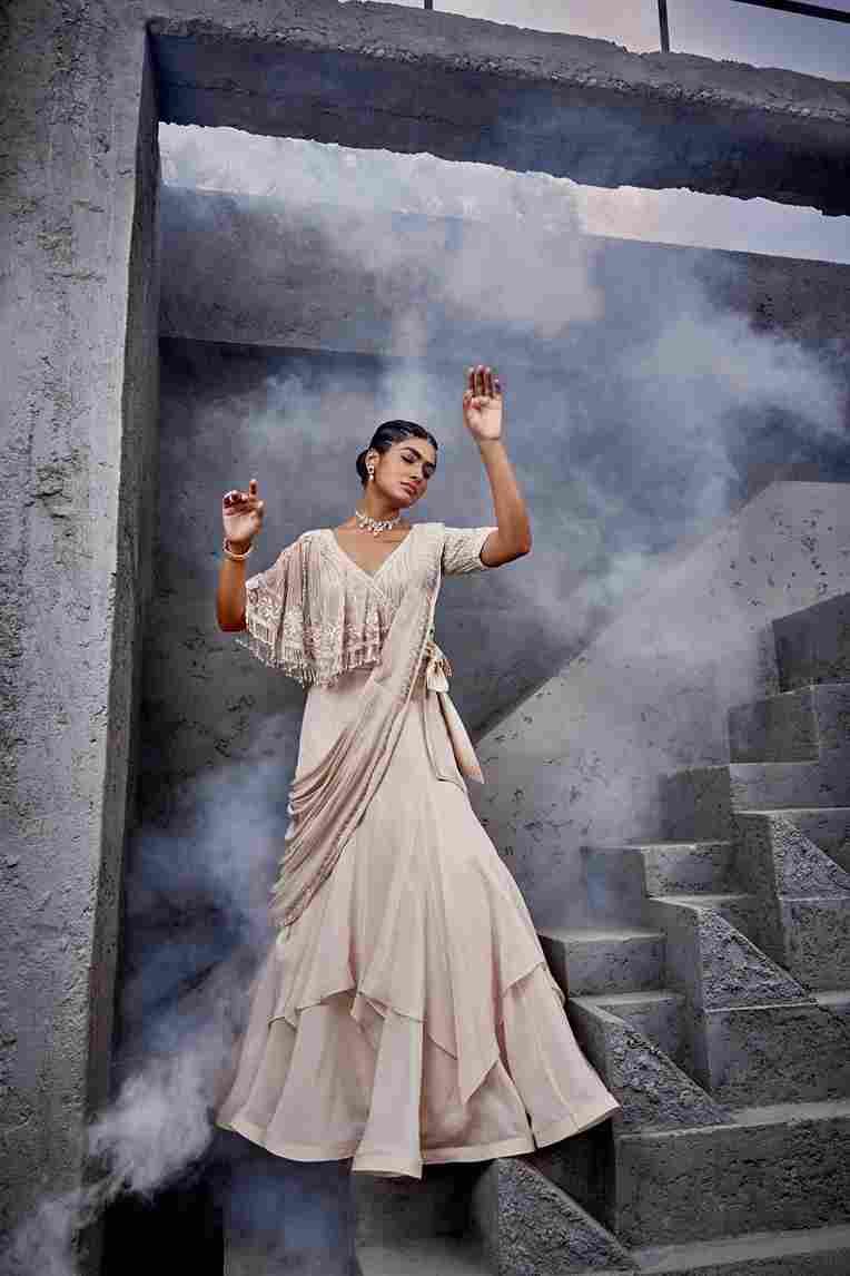 A model showcasing Half Cape Drape Saree by Miku Kumar from Miku Kumar's collection