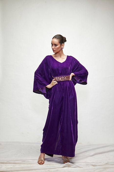 A model showcasing Violet Velvet Kaftaan by Ranian from Ranian's collection A model showcasing Violet Velvet Kaftaan by Ranian from Ranian's collection