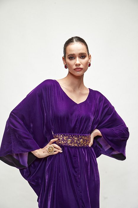 A model showcasing Violet Velvet Kaftaan by Ranian from Ranian's collection A model showcasing Violet Velvet Kaftaan by Ranian from Ranian's collection