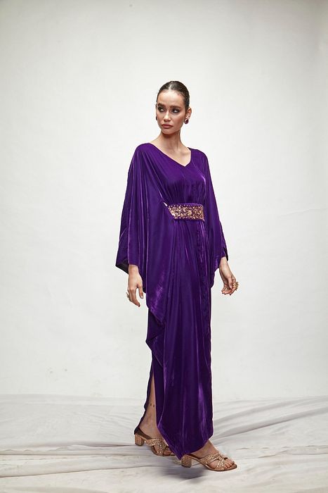 A model showcasing Violet Velvet Kaftaan by Ranian from Ranian's collection A model showcasing Violet Velvet Kaftaan by Ranian from Ranian's collection