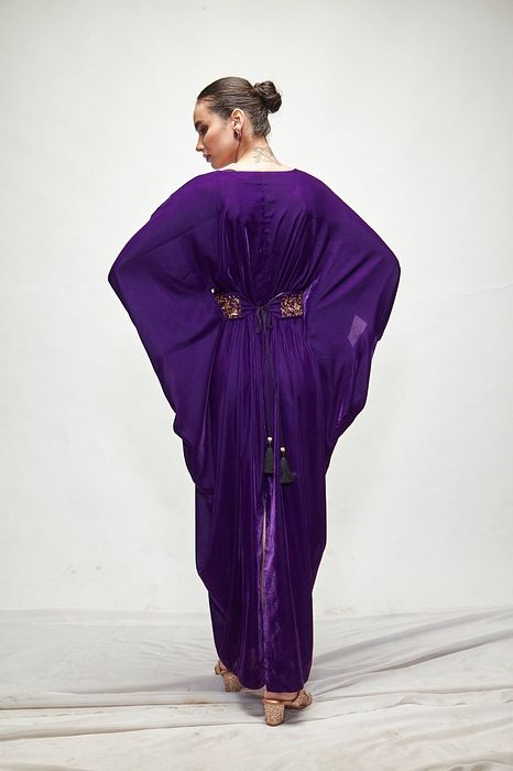 A model showcasing Violet Velvet Kaftaan by Ranian from Ranian's collection A model showcasing Violet Velvet Kaftaan by Ranian from Ranian's collection