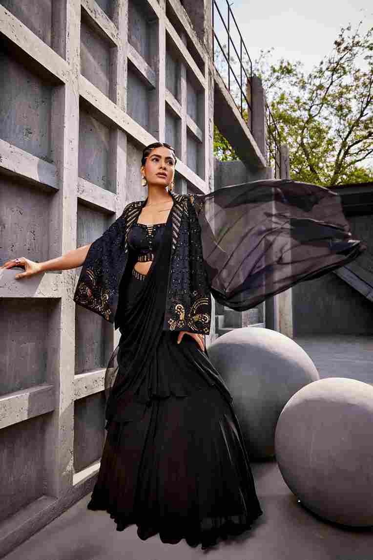 A model showcasing Black Draped Saree Lehenga by Miku Kumar from Miku Kumar's collection