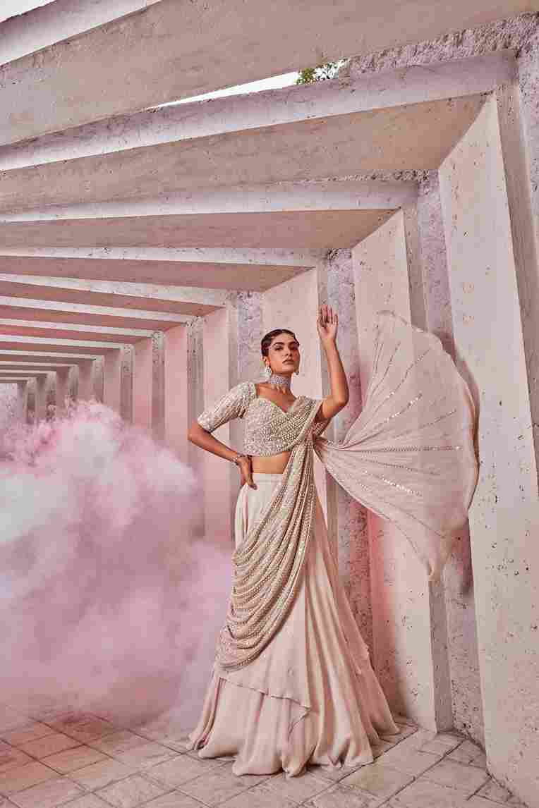 A model showcasing Draped Lahenga Choli by Miku Kumar from Miku Kumar's collection