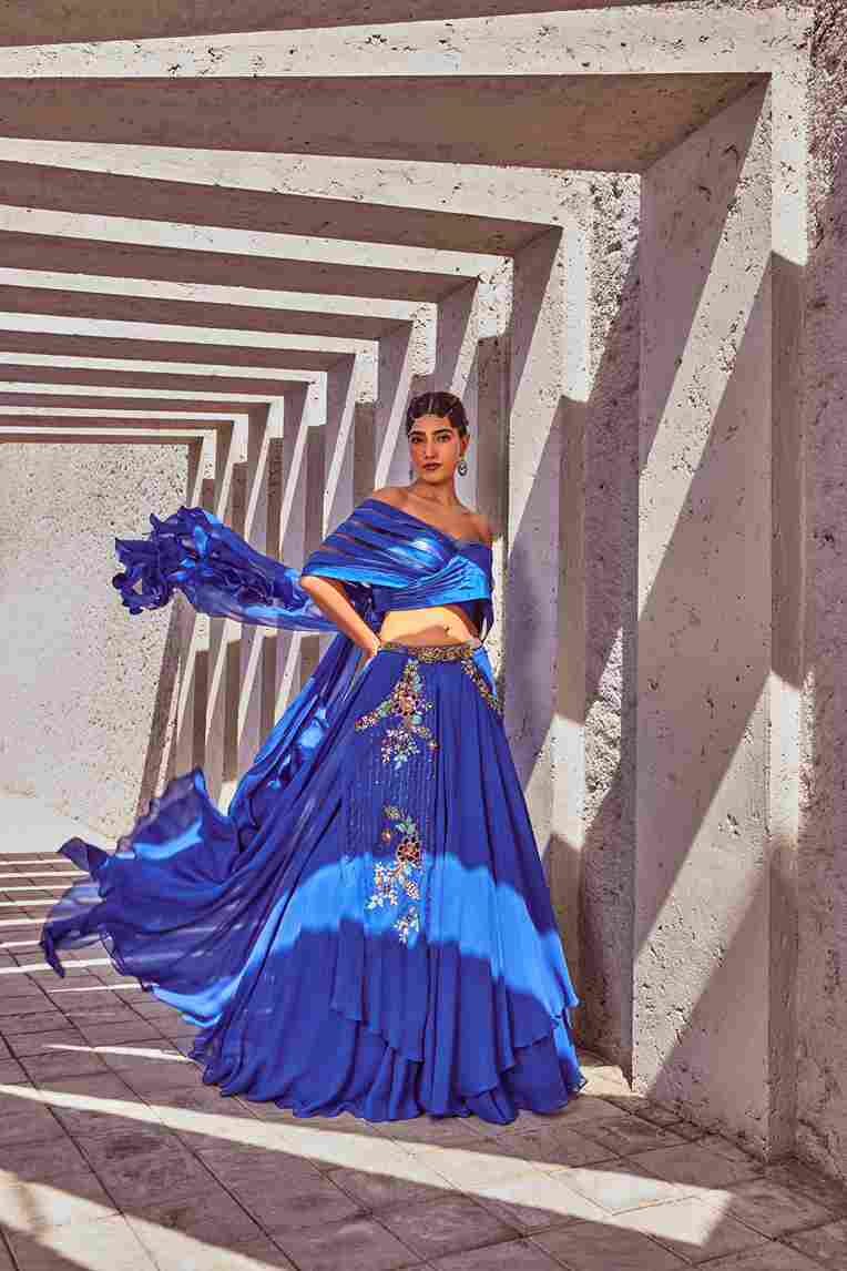 A model showcasing Blue Long Skirt With Layered Blouse by Miku Kumar from Miku Kumar's collection