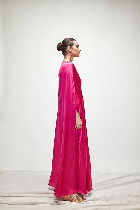 A model showcasing Fuschia Silk Kaftaan by Ranian from Ranian's collection A model showcasing Fuschia Silk Kaftaan by Ranian from Ranian's collection