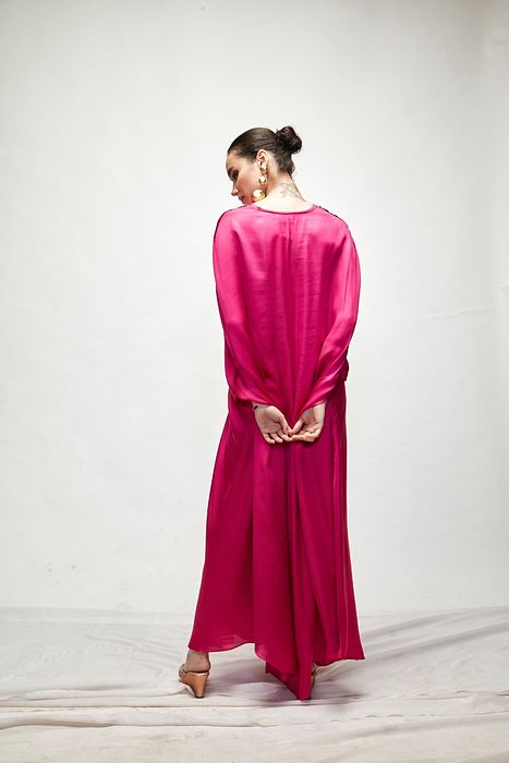 A model showcasing Fuschia Silk Kaftaan by Ranian from Ranian's collection A model showcasing Fuschia Silk Kaftaan by Ranian from Ranian's collection