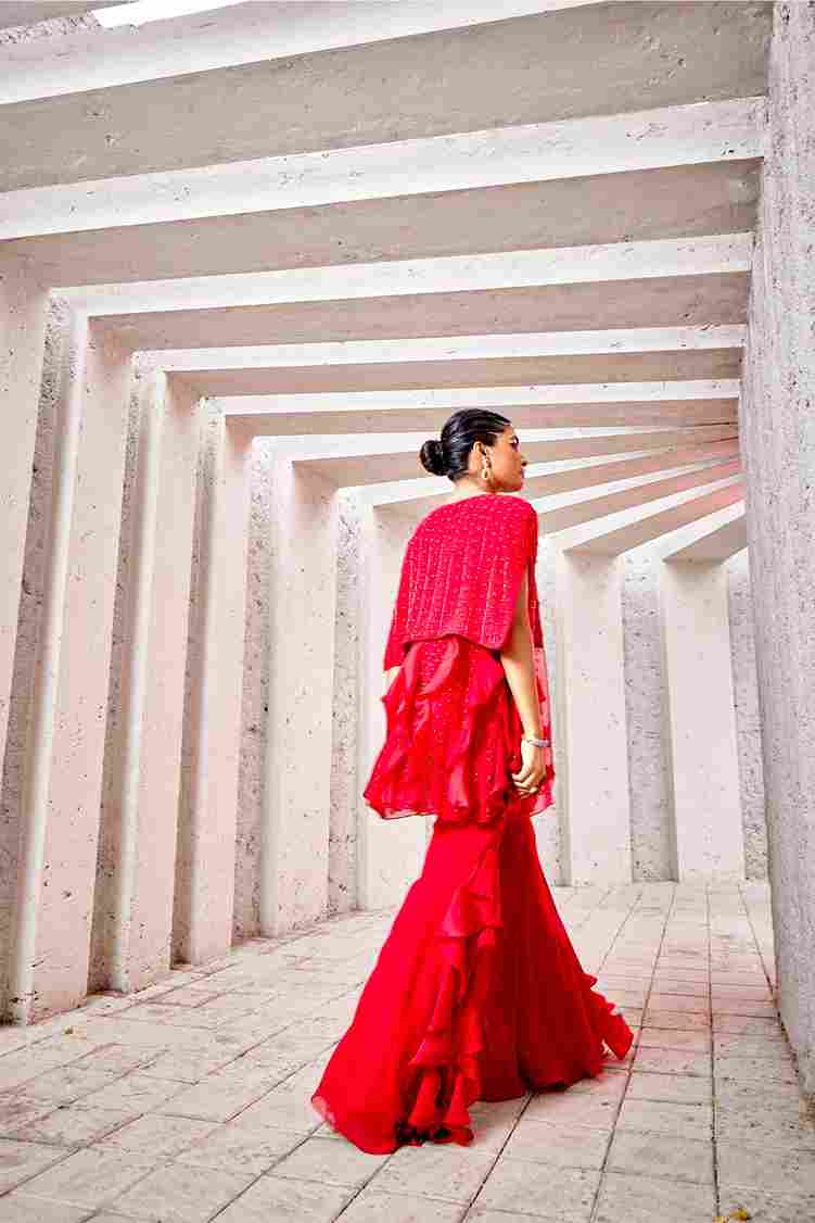 A model showcasing Red Indo Western Dress by Miku Kumar from Miku Kumar's collection