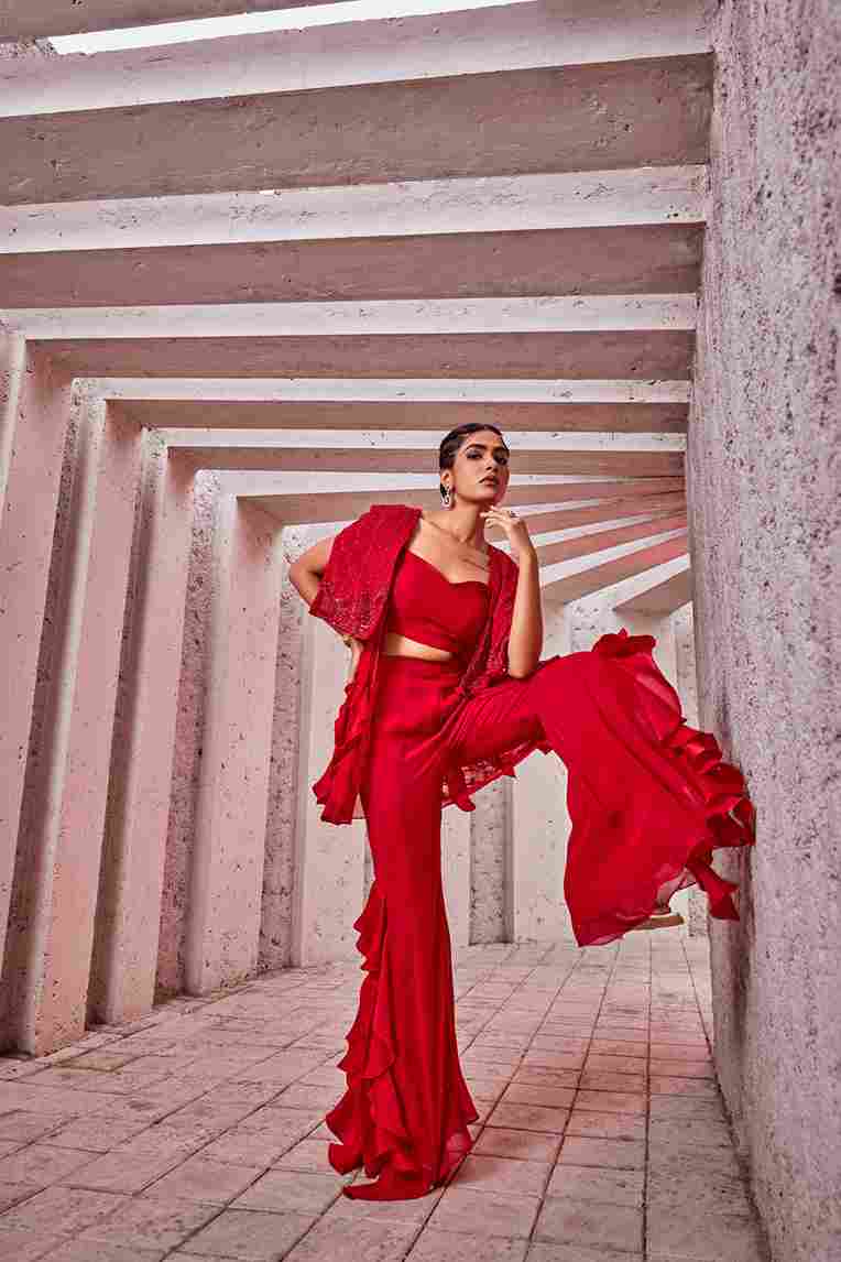 A model showcasing Red Indo Western Dress by Miku Kumar from Miku Kumar's collection