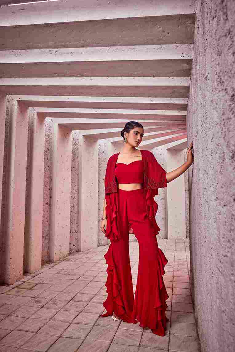 A model showcasing Red Indo Western Dress by Miku Kumar from Miku Kumar's collection