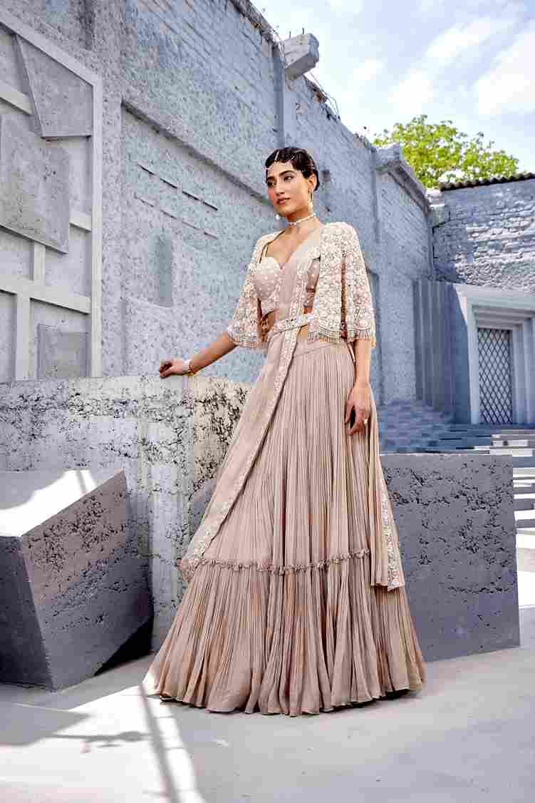 A model showcasing Corset Blouse Lehenga by Miku Kumar from Miku Kumar's collection