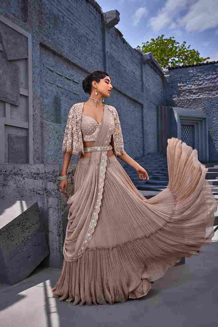 A model showcasing Corset Blouse Lehenga by Miku Kumar from Miku Kumar's collection