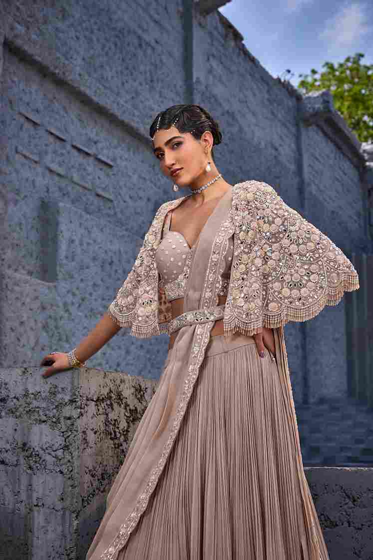 A model showcasing Corset Blouse Lehenga by Miku Kumar from Miku Kumar's collection