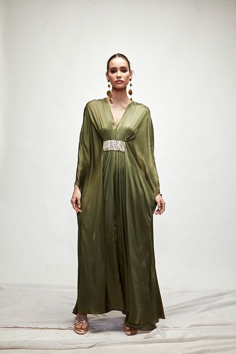 A model showcasing Olive Green Silk Kaftaan by Ranian from Ranian's collection A model showcasing Olive Green Silk Kaftaan by Ranian from Ranian's collection