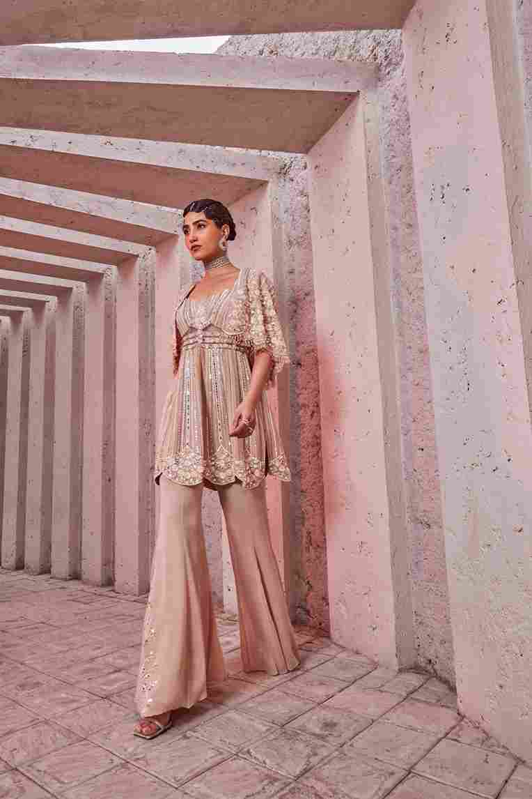 A model showcasing Corset Kurti With Retro Pants by Miku Kumar from Miku Kumar's collection