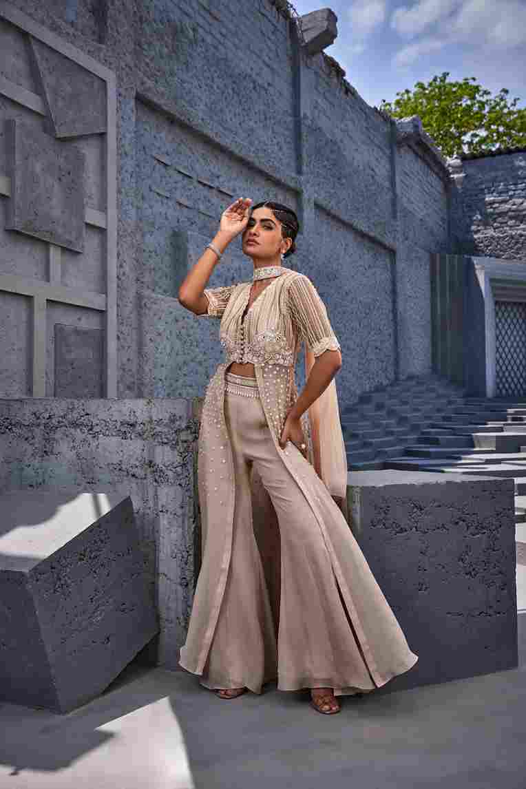 A model showcasing Retro Pants With Bustier by Miku Kumar from Miku Kumar's collection