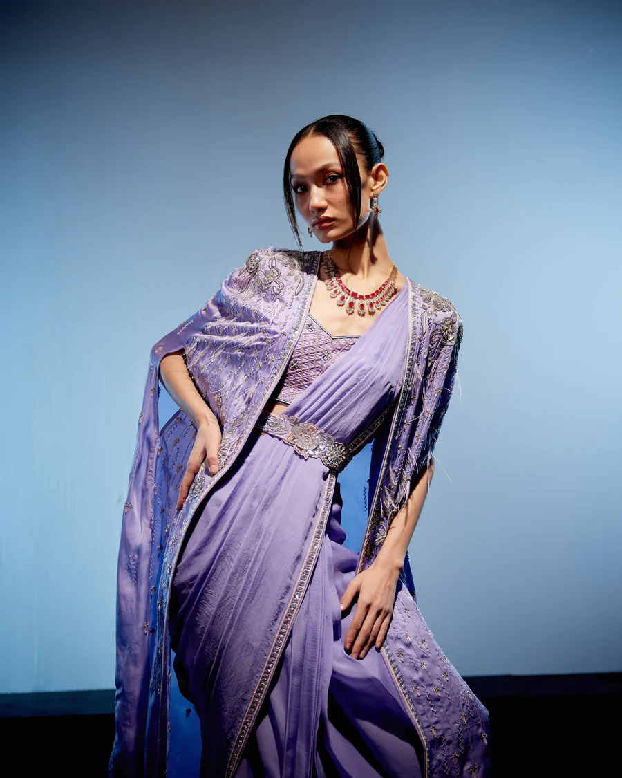 A model showcasing Orchid Drape Saree by Miku Kumar from Miku Kumar's collection