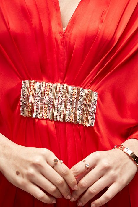 A model showcasing Red Silk Kaftaan by Ranian from Ranian's collection A model showcasing Red Silk Kaftaan by Ranian from Ranian's collection