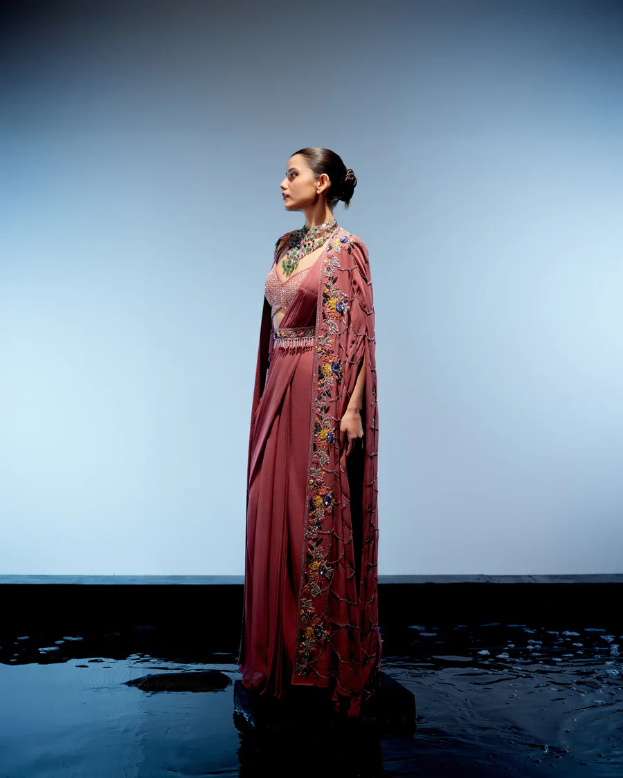 A model showcasing Sienna Drape Saree by Miku Kumar from Miku Kumar's collection