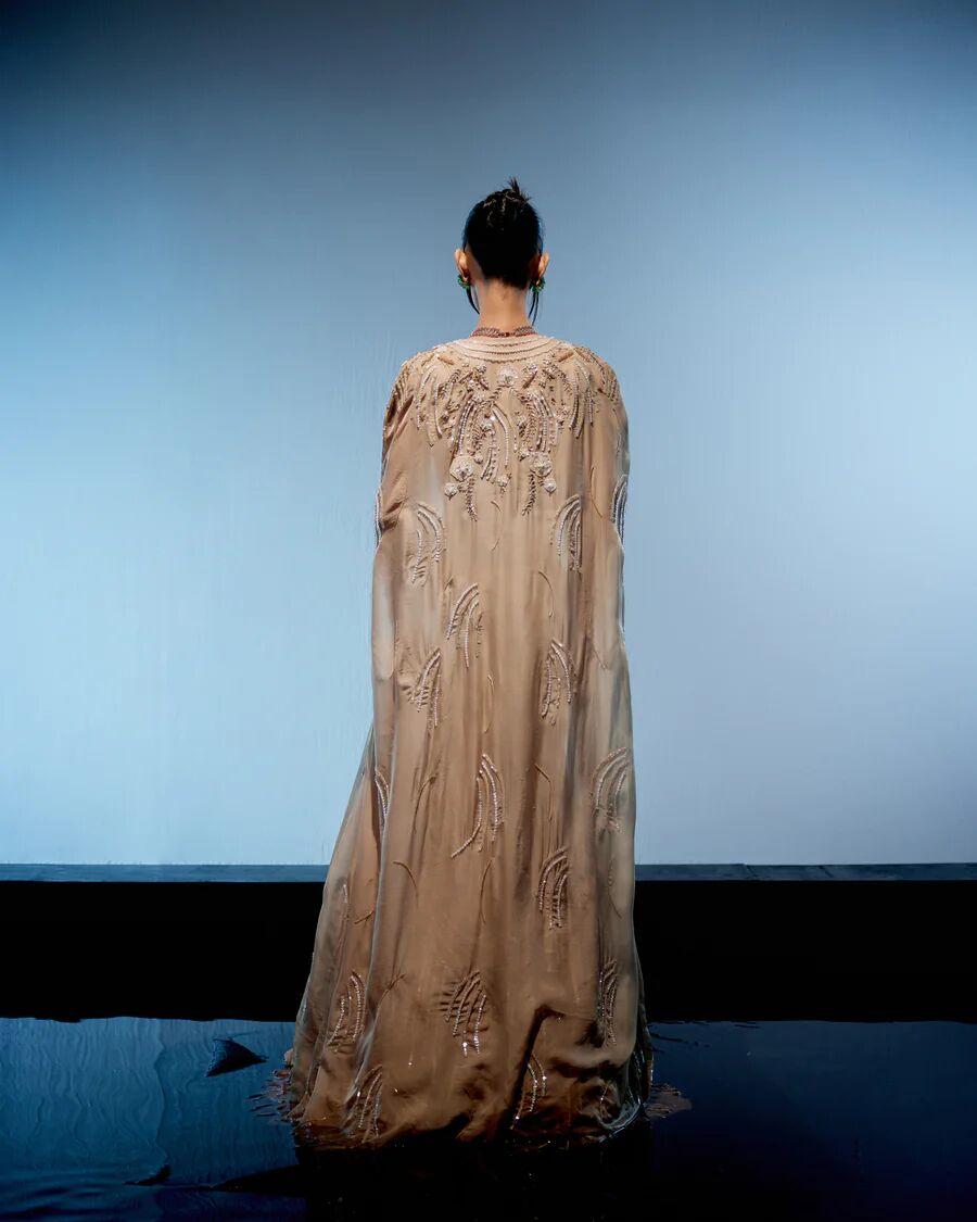 A model showcasing Ivory Bianca Lehenga by Miku Kumar from Miku Kumar's collection