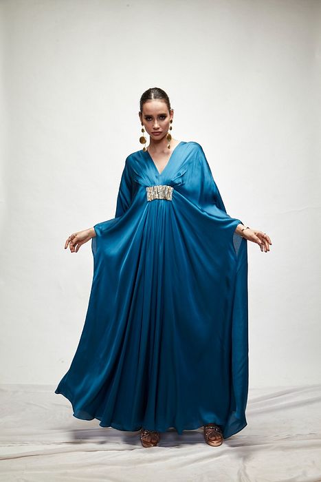 A model showcasing Persian Blue Silk Kaftaan by Ranian from Ranian's collection