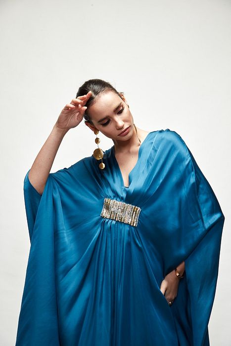 A model showcasing Persian Blue Silk Kaftaan by Ranian from Ranian's collection