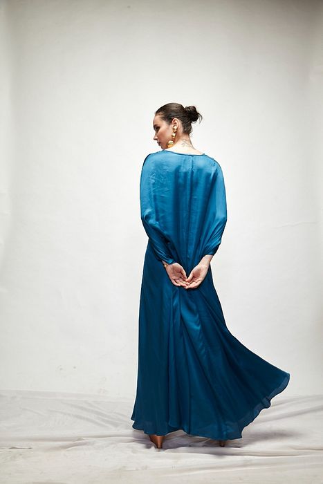 A model showcasing Persian Blue Silk Kaftaan by Ranian from Ranian's collection