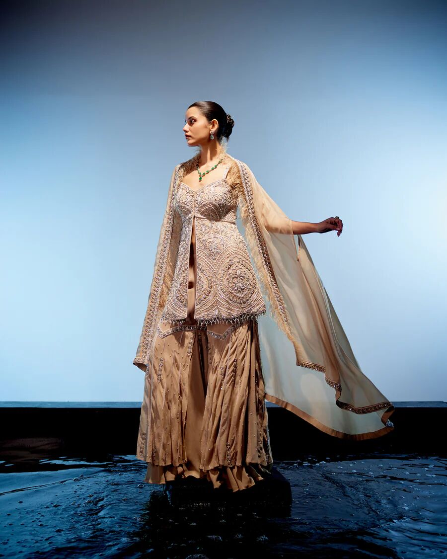 A model showcasing Valerie Sharara Set by Miku Kumar from Miku Kumar's collection