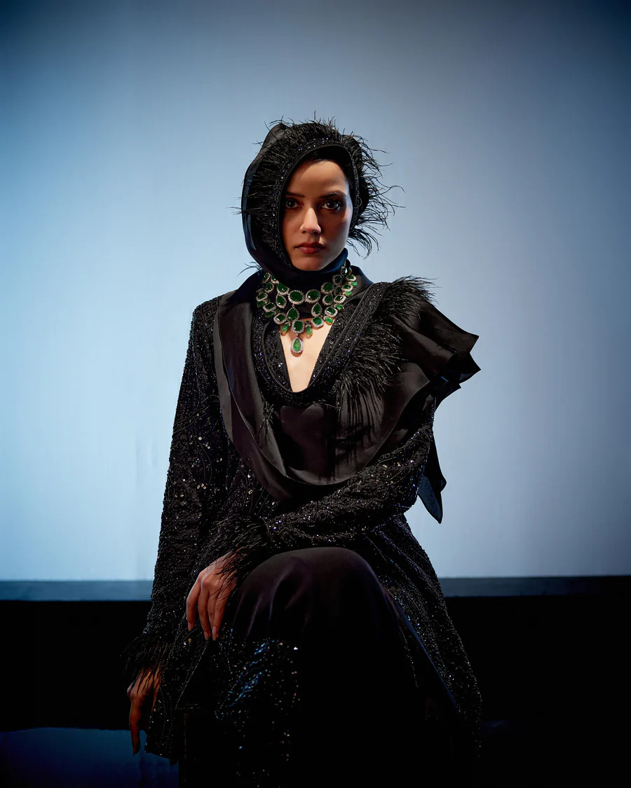 A model showcasing Raven Sharara Set by Miku Kumar from Miku Kumar's collection