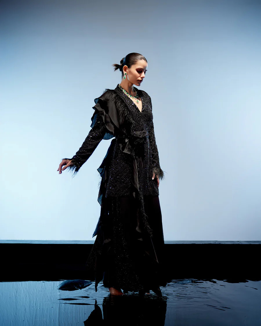 A model showcasing Raven Sharara Set by Miku Kumar from Miku Kumar's collection