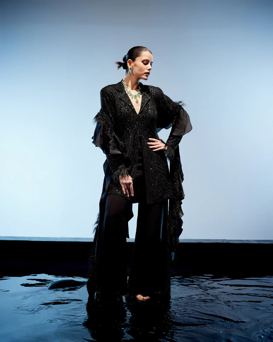 A model showcasing Raven Sharara Set by Miku Kumar from Miku Kumar's collection