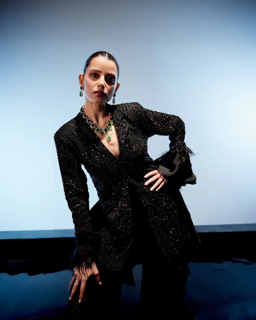 A model showcasing Raven Sharara Set by Miku Kumar from Miku Kumar's collection