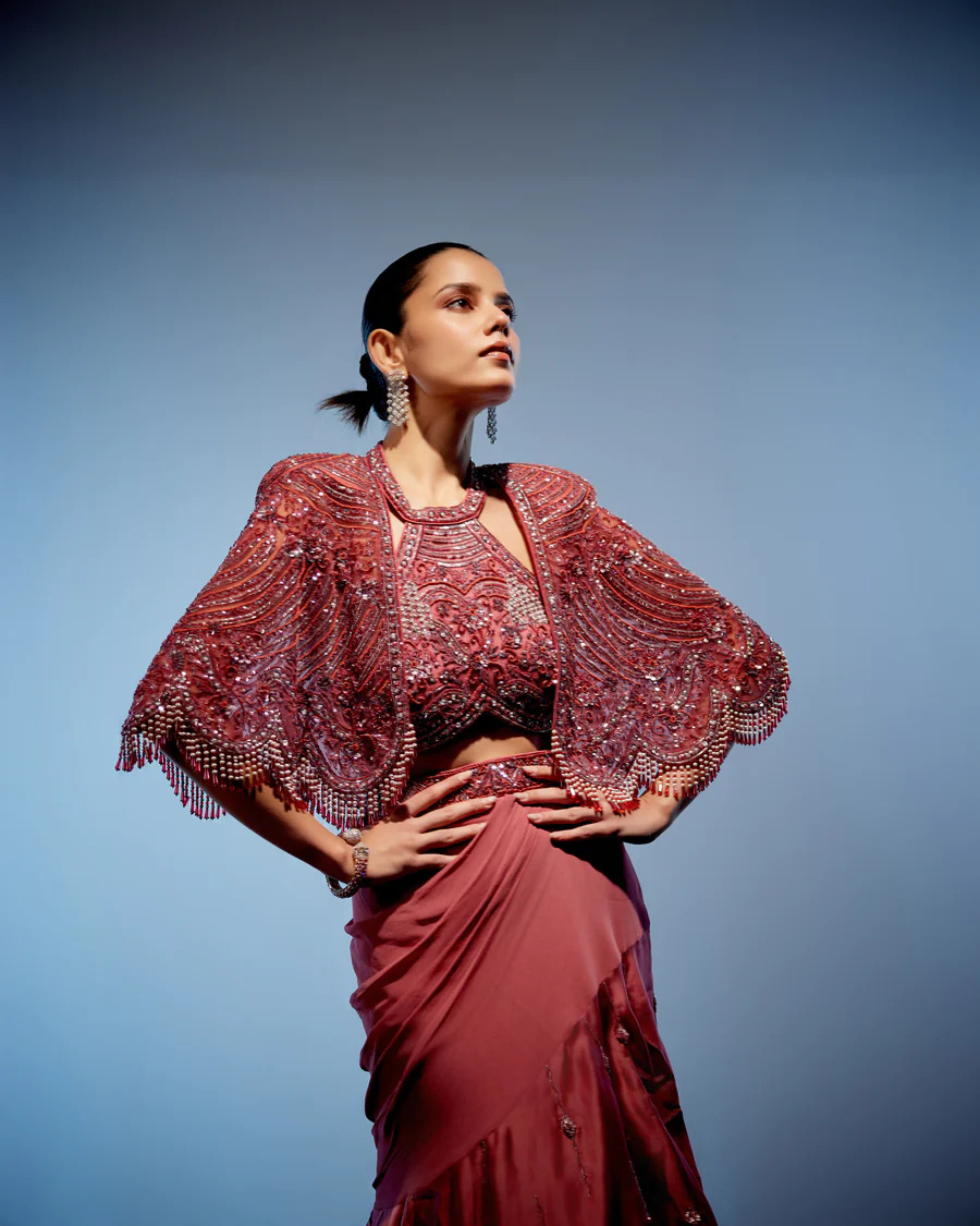 A model showcasing Coralie Lehenga Set by Miku Kumar from Miku Kumar's collection