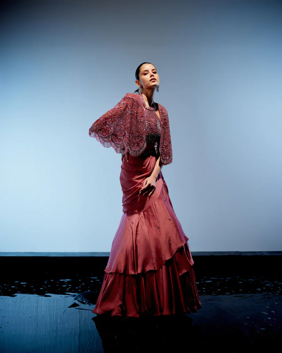A model showcasing Coralie Lehenga Set by Miku Kumar from Miku Kumar's collection