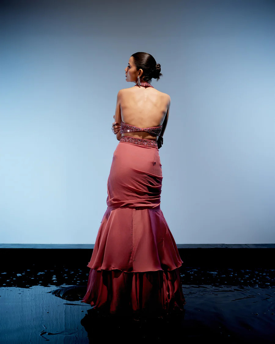 A model showcasing Coralie Lehenga Set by Miku Kumar from Miku Kumar's collection
