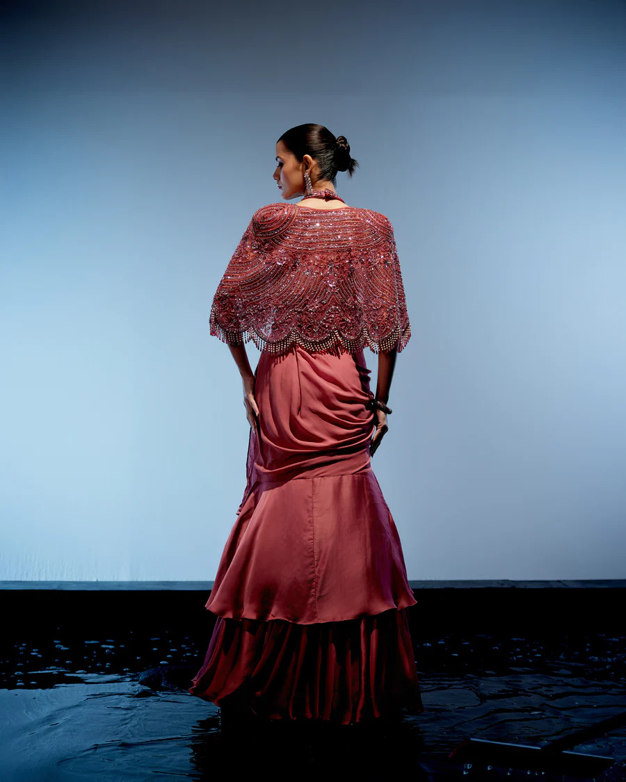 A model showcasing Coralie Lehenga Set by Miku Kumar from Miku Kumar's collection