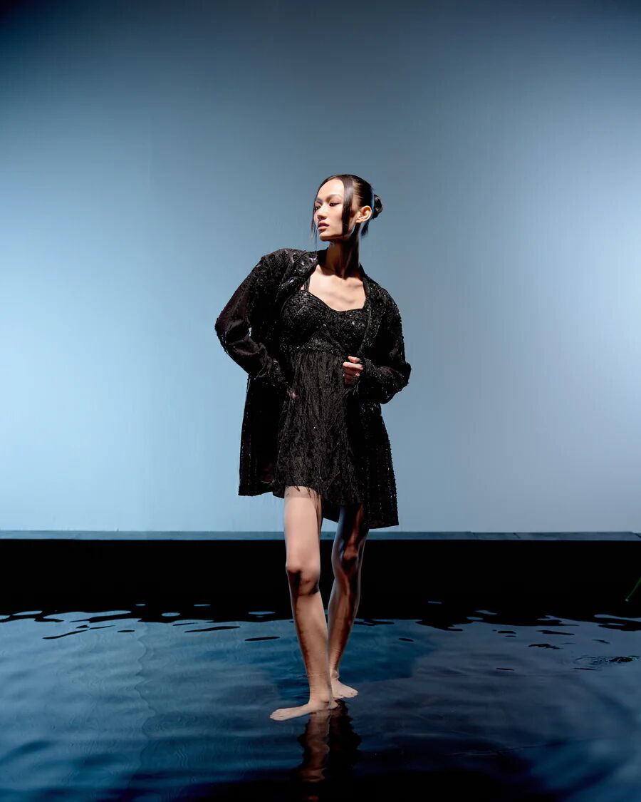 A model showcasing Black Ebony Jacket Dress by Miku Kumar from Miku Kumar's collection