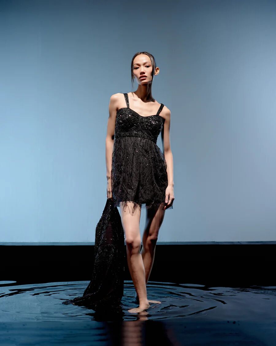 A model showcasing Black Ebony Jacket Dress by Miku Kumar from Miku Kumar's collection