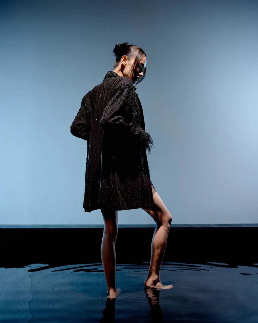 A model showcasing Black Ebony Jacket Dress by Miku Kumar from Miku Kumar's collection