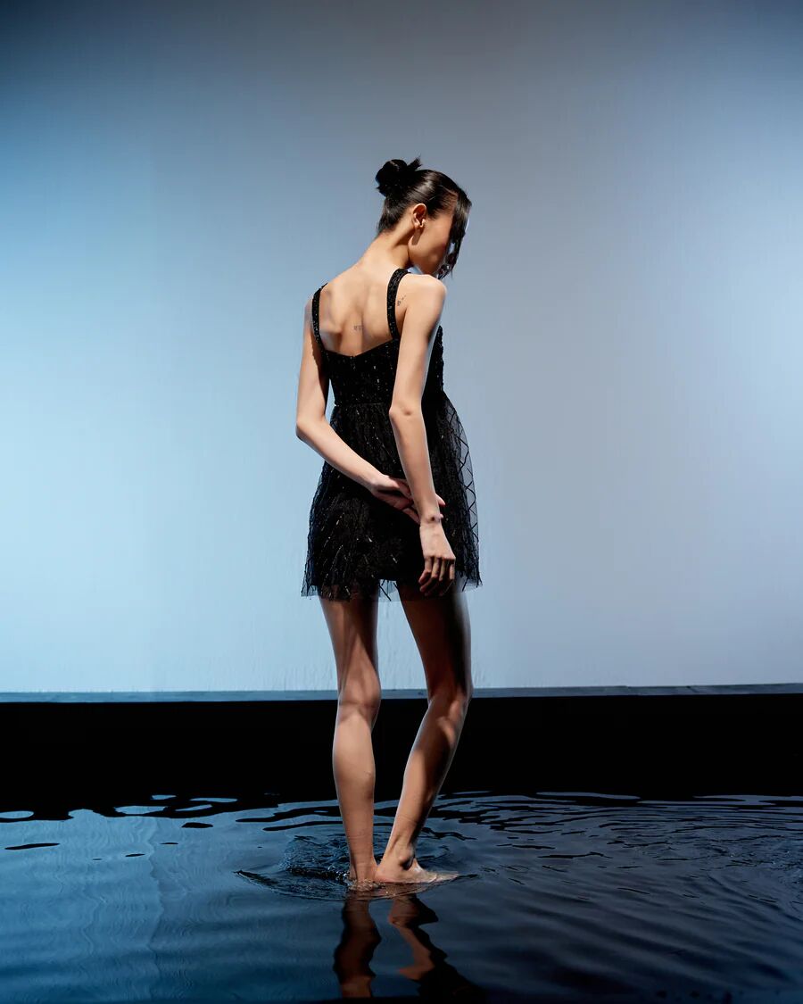 A model showcasing Black Ebony Jacket Dress by Miku Kumar from Miku Kumar's collection