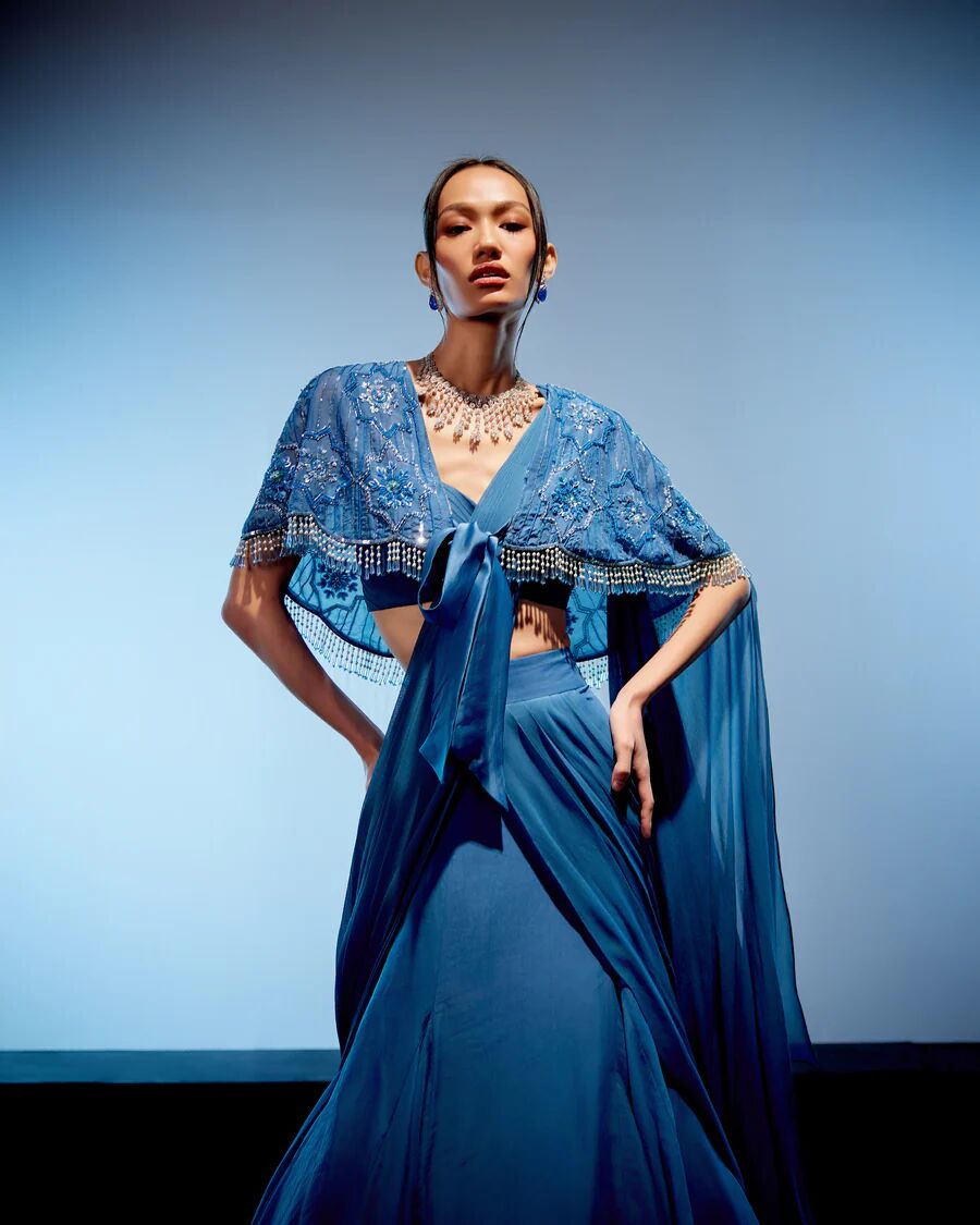 A model showcasing Marlin Drape Saree by Miku Kumar from Miku Kumar's collection