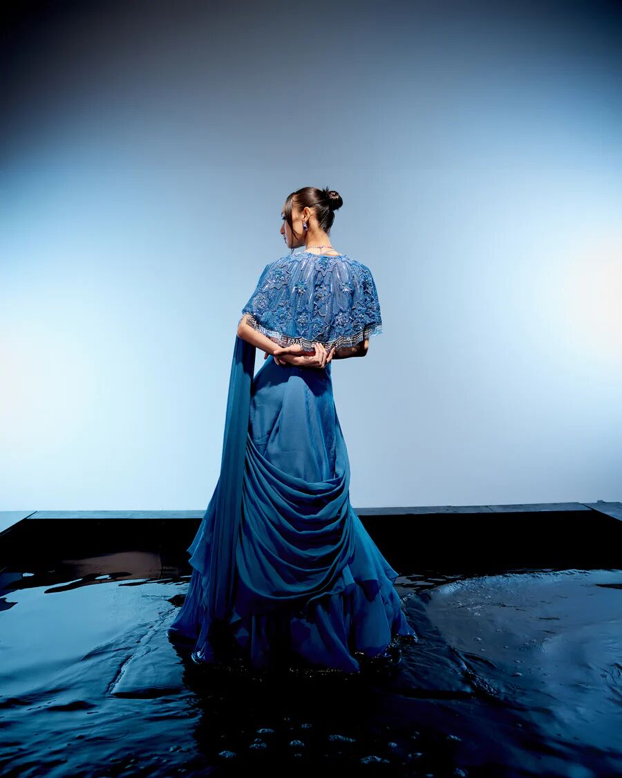 A model showcasing Marlin Drape Saree by Miku Kumar from Miku Kumar's collection