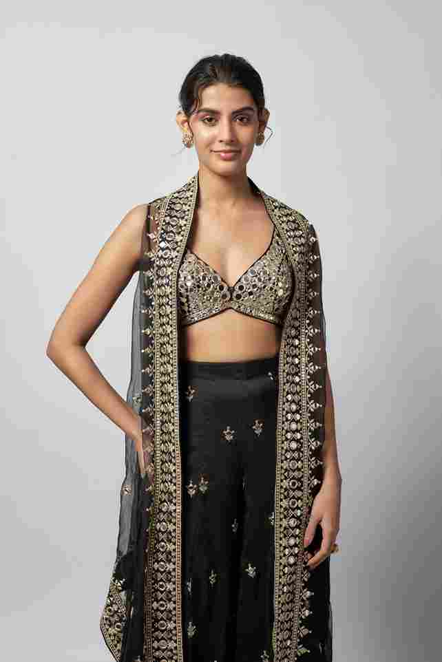 A model showcasing Avnoor Pant Set by Gopi Vaid from Gopi Vaid's collection A model showcasing Avnoor Pant Set by Gopi Vaid from Gopi Vaid's collection