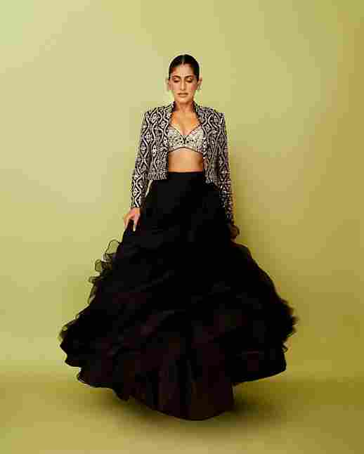 A model showcasing Gandhara Skirt Set by Gopi Vaid from Gopi Vaid's collection