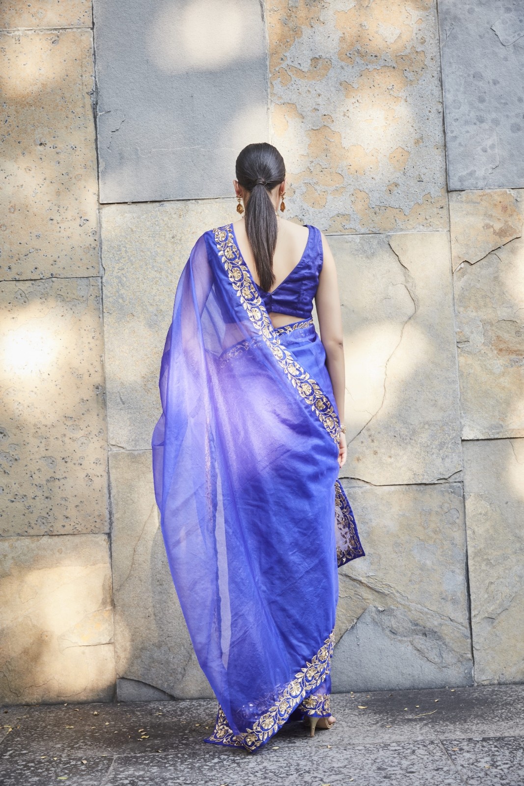 A model showcasing Purple Silk Organza Saree by Ranian from Ranian's collection A model showcasing Purple Silk Organza Saree by Ranian from Ranian's collection