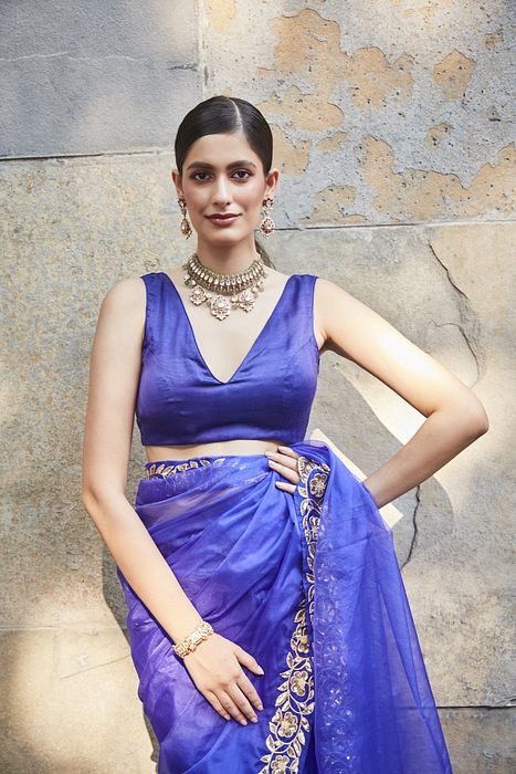 A model showcasing Purple Silk Organza Saree by Ranian from Ranian's collection A model showcasing Purple Silk Organza Saree by Ranian from Ranian's collection